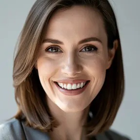 Close-up portrait of a friendly woman in her late 20s, warm smile, natural daylight, neutral background, realistic photography, sharp focus, head and shoulders, no text, no logos
